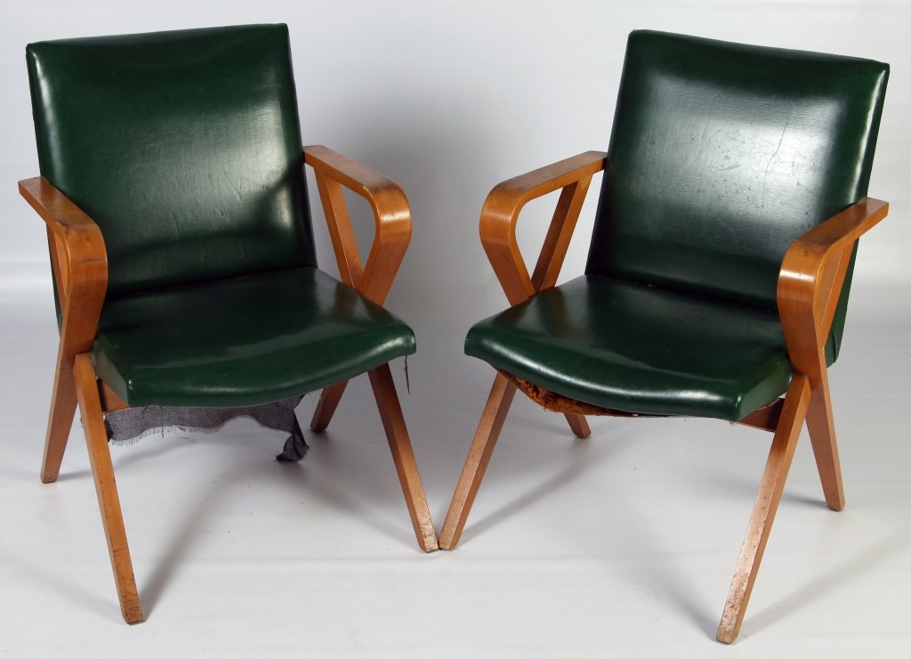PAIR THONET BENT WOOD ARM CHAIRS CIRCA 1940: Laminated maple arms and solid maple legs, original green vinyl covering, original tags. Each measures 33 x 23.75 x 22 inches. Provenance: The Estate of Kansas Artist David Melby. We are happy to offe