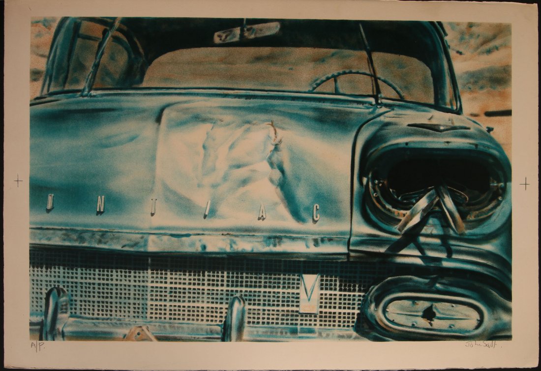 JOHN SALT (B. 1937) PHOTOREALIST PENCIL-SIGNED LITHO: Color lithograph circa 1972 titled 'Desert Wreck,' this image signed lower right in pencil and annotated lower left A. P. for artist's proof. The overall sheet complete with four deckled edges measure
