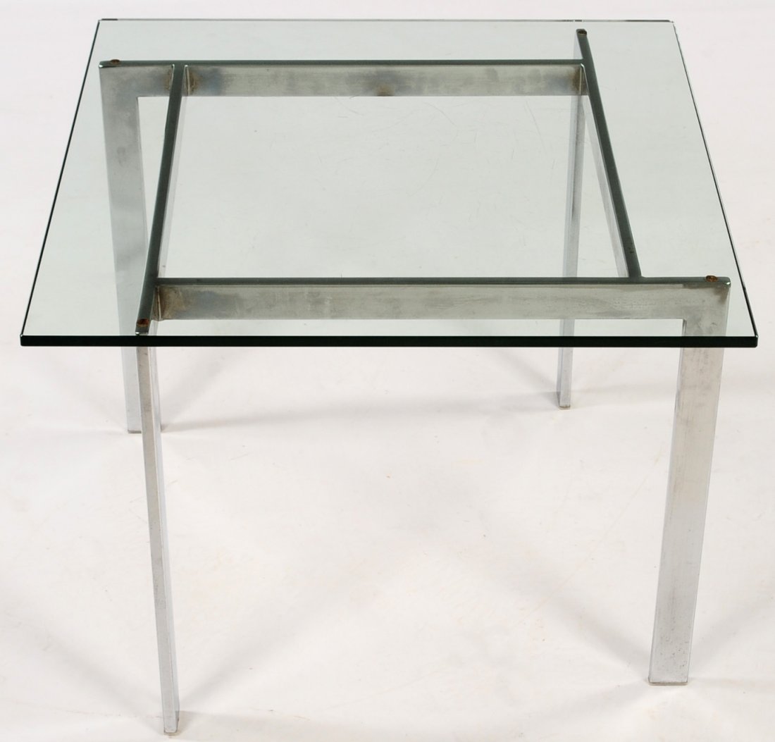 MILO BAUGHMAN STYLE MODERN DESIGN SIDE TABLE: Geometric chrome base and quarter inch plate glass top. Measures 18.5 x 24 x 24 inches.