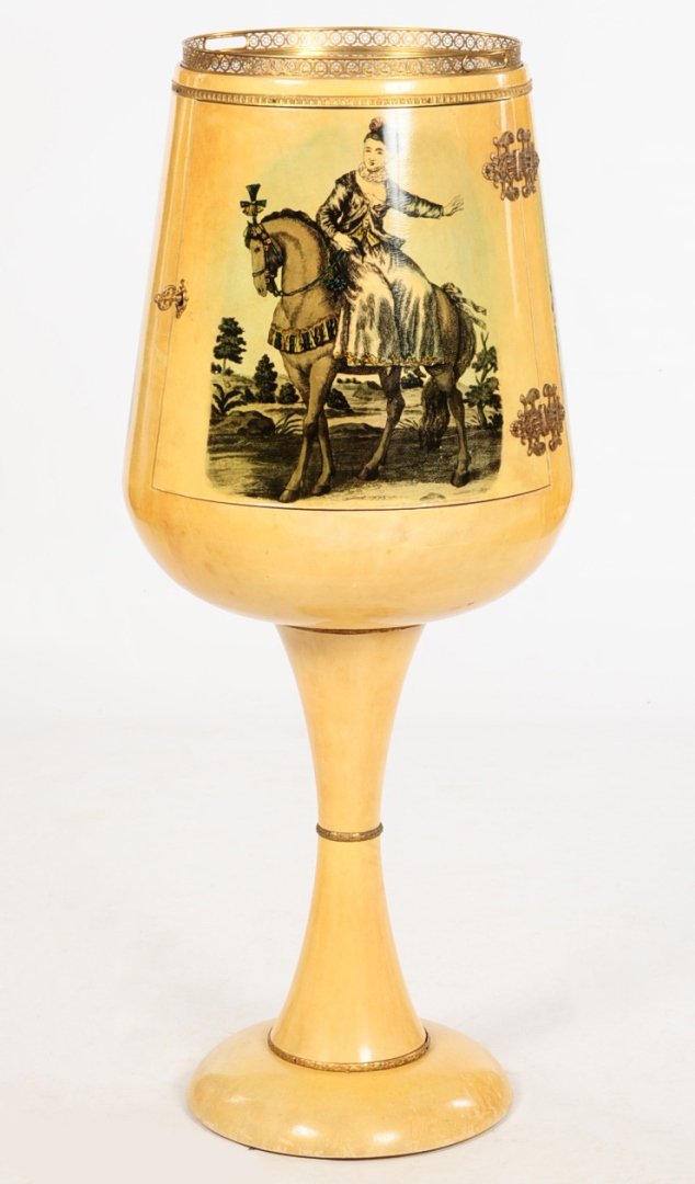 ALDO TURA DESIGN GOBLET SHAPE DRY BAR CIRCA 1965: A floor standing goblet shape cabinet clad in painted and varnished goat skin parchment, dramatic brass door mountings, removable brass gallery tray, the illuminated interior lined with mirrors and se