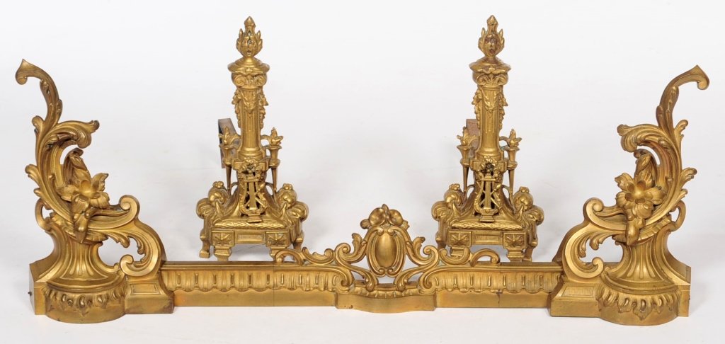 ANTIQUE FRENCH BRONZE FENDER AND ANDIRONS: A Rococo fender measuring 17.5 x 38.5 x 5 inches and Empire style andirons 17.5 x 19.5 x 8.5 inches.We are happy to offer in-house shipping for all but very large or very fragile items. Some internati