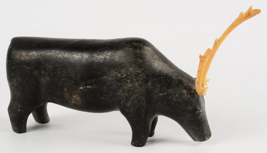 AN INUIT CARVED SOAPSTONE SCULPTURE OF A CARIBOU (1 of 10)