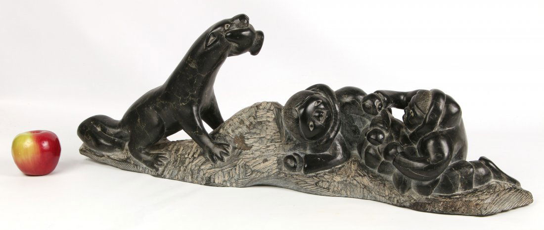 A RARE AND COMICAL 30-INCH INUIT SOAPSTONE SCULPTURE (1 of 10)