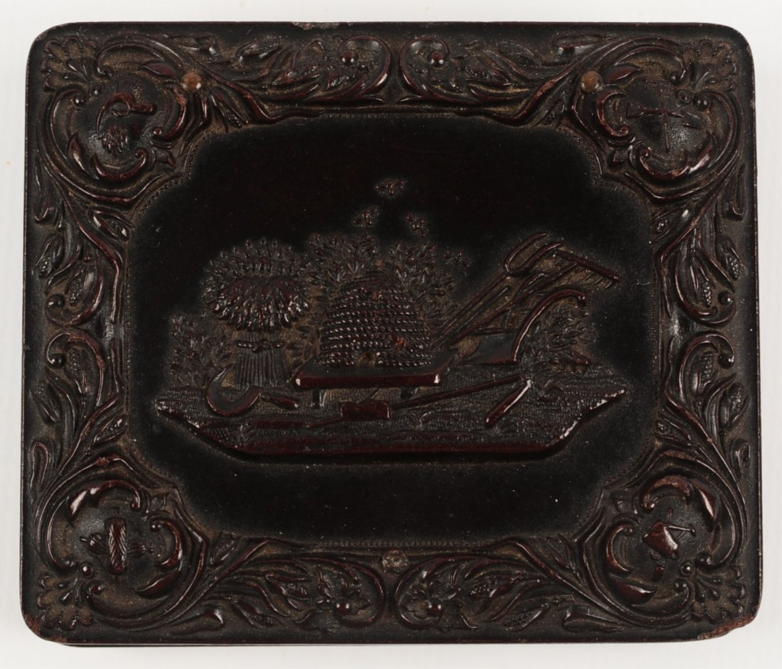 NINTH-PLATE BEEHIVE UNION CASE WITH AMBROTYPE: Littlefield, Parsons & Co. Union case with a beehive and plough, ambrotype of a young woman, measures 3 x 2.5 inches.We are happy to offer in-house shipping for all but very large or very fragile item