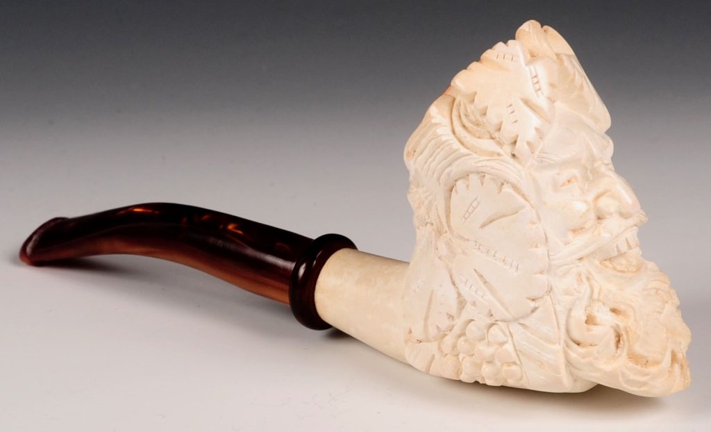 CAO MEERSCHAUM BACCHUS ESTATE PIPE, WITH CASE: Handcrafted Cao meerschaum bacchus figural estate pipe, smoked, approximately 6 inches, Cao marked stem. Includes form fitted brown leatherette case. We are happy to offer in-house shipping for all bu