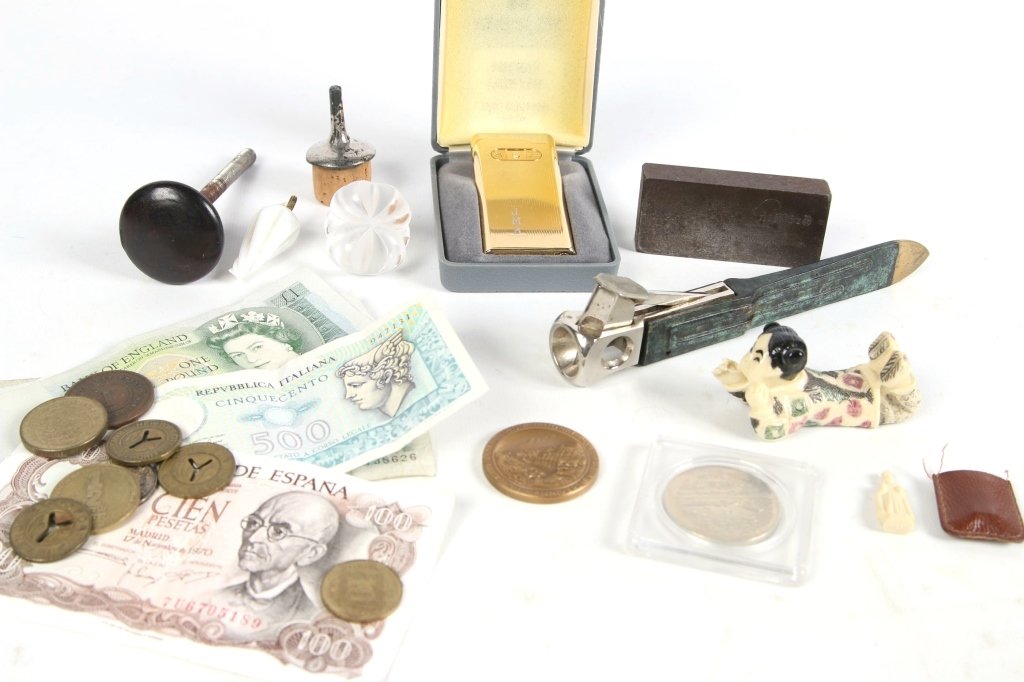 LOT OF ESTATE ITEMS: Cigar cutter, lighter, carved figures, foreign currancy, all as shown. We are happy to offer in-house shipping for all but very large or very fragile items. Some international orders my need to be han