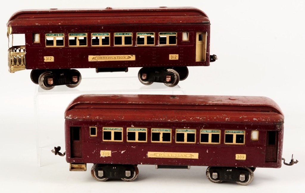 LIONEL STANDARD GAUGE PULLMAN AND OBSERVATION CAR: Including #309 Pullman car and #312 Observation car in maroon with terra cotta color. We are happy to offer in-house shipping for all but very large or very fragile items. Some international orders my