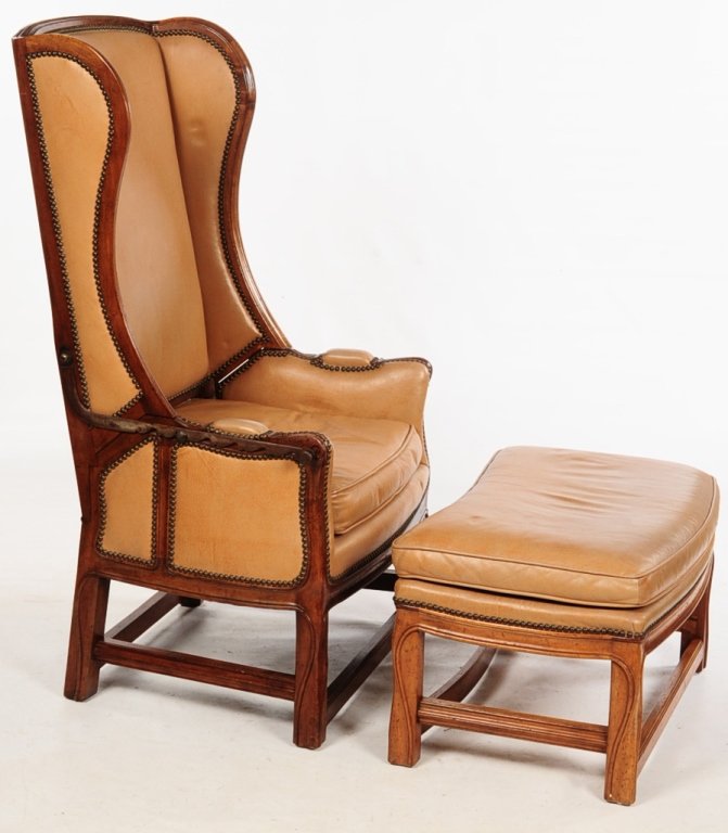 ANTIQUE METAMORPHIC RECLINING WING CHAIR WITH FOOT: Exposed wood molded frame with raised serpentine line, arched crest having upholstered scrolling wings continuing to padded serpentine arms above an upholstered cushioned seat, adjustable iron bracket