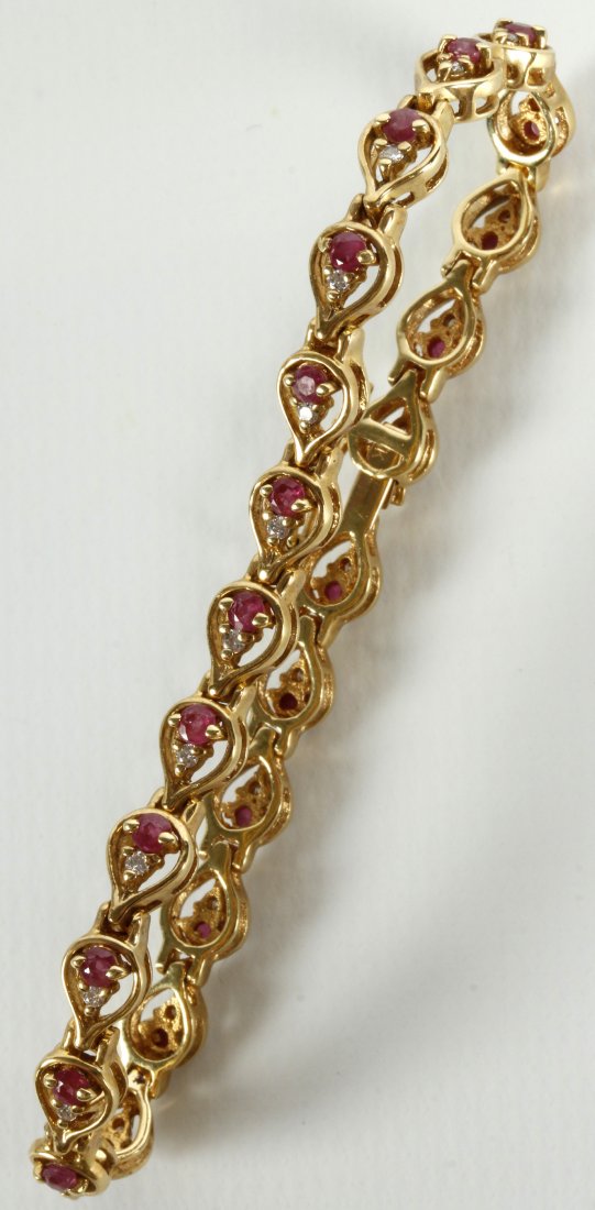 AN 18K YELLOW GOLD RUBY AND DIAMOND LINK BRACELET (1 of 10)