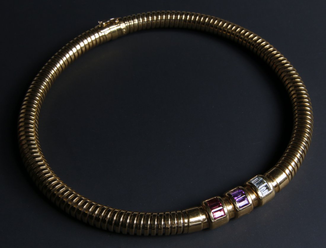 14K NOUVELLE BAGUE FLEXIBLE SNAKE CHOKER WITH GEMS: A 9mm round snake style flexible choker set with three each rhodolite, amethyst and aquamarine emerald shaped stones. Signed Nouvelle Bague France near the clasp. Nice built-in box clasp with a safety