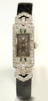 AN ART DECO PLATINUM LADIES' DIAMOND & EMERALD WATCH