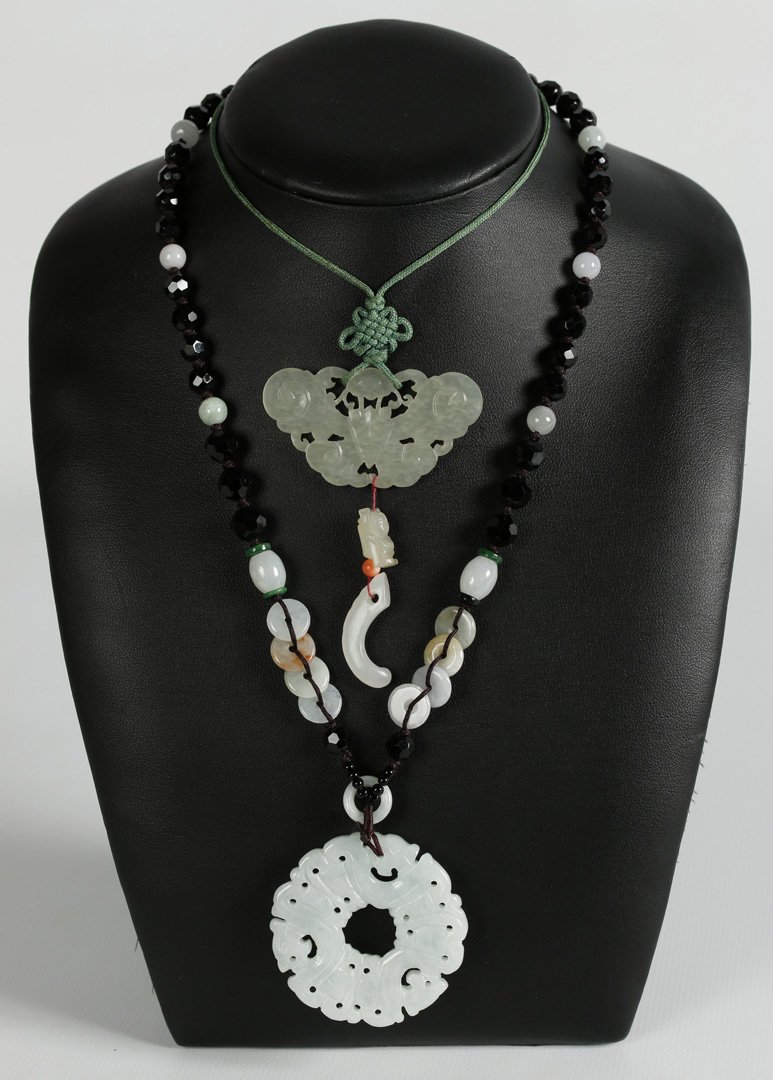 TWO CARVED JADE PENDANTS (1 of 8)