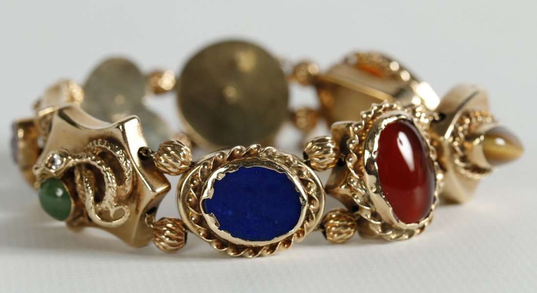 A BRACELET OF EIGHT VICTORIAN 14K GOLD WATCH SLIDES (1 of 8)