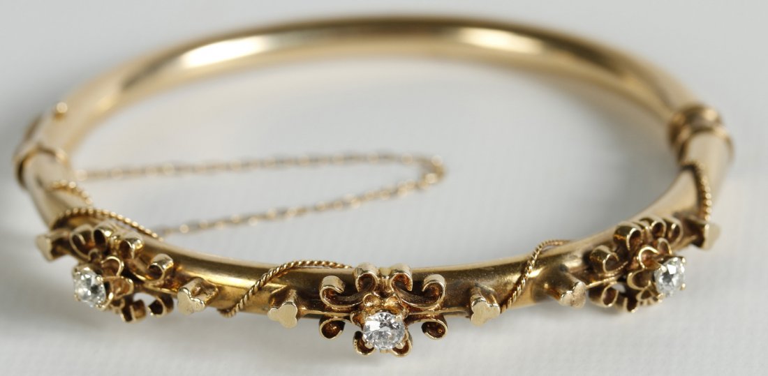 AN ANTIQUE 14 KT GOLD BANGLE BRACELET WITH DIAMONDS (1 of 5)