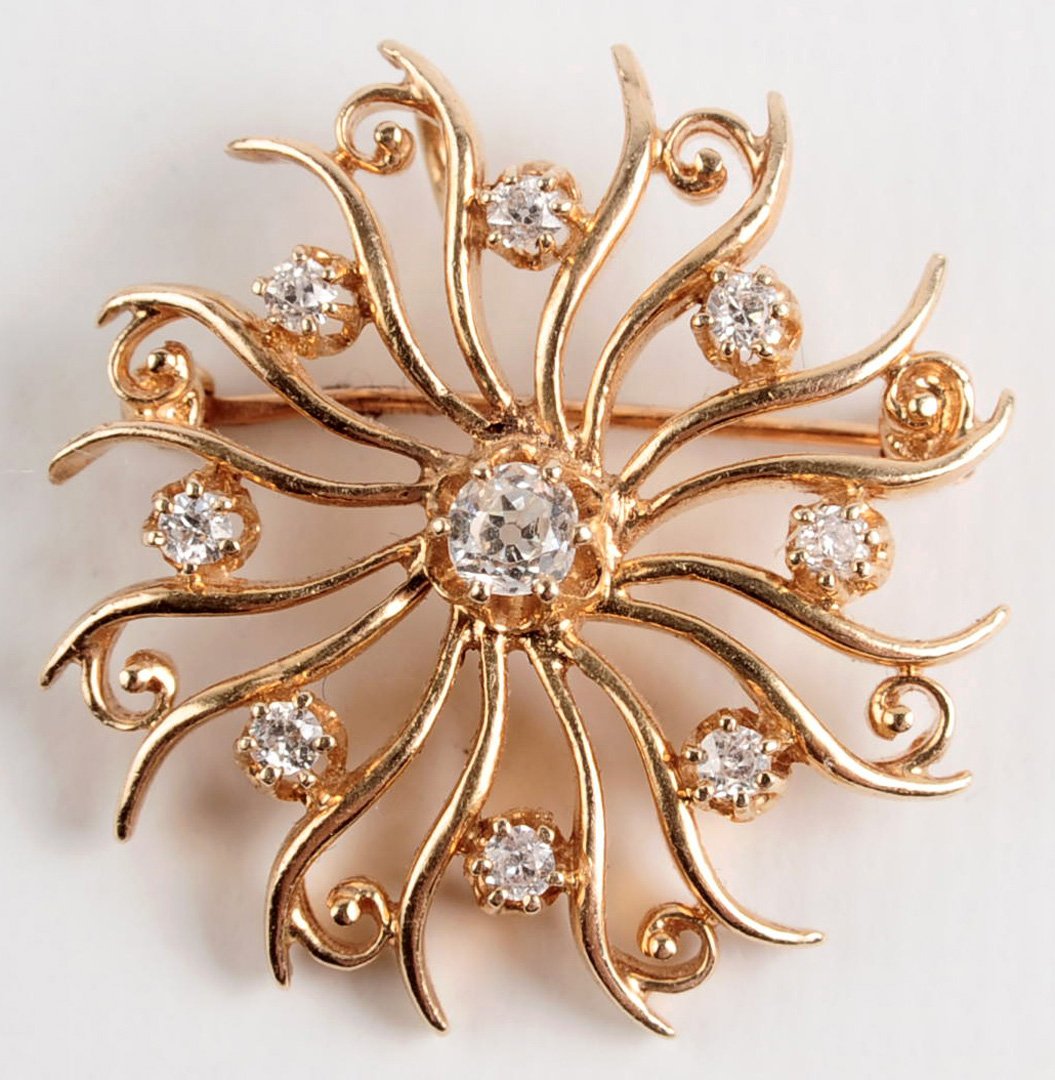 AN ANTIQUE DIAMOND AND 14K GOLD SUNBURST BROOCH (1 of 7)