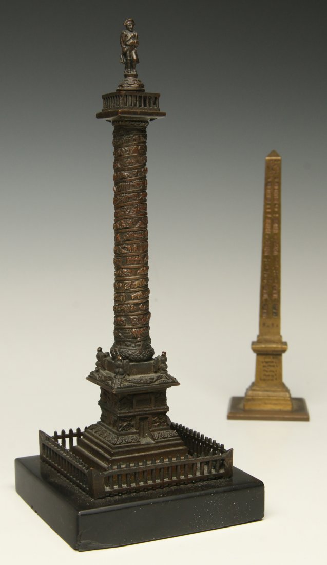 A PAIR OF BRONZE GRAND TOUR MONUMENT REPLICAS: A 19th century patinated bronze model of Vendome's Column on slate base measures 7.5 x 3 inches. Plus a bronze model of the Vatican Obelisk 5.75 x 1.75 inches.