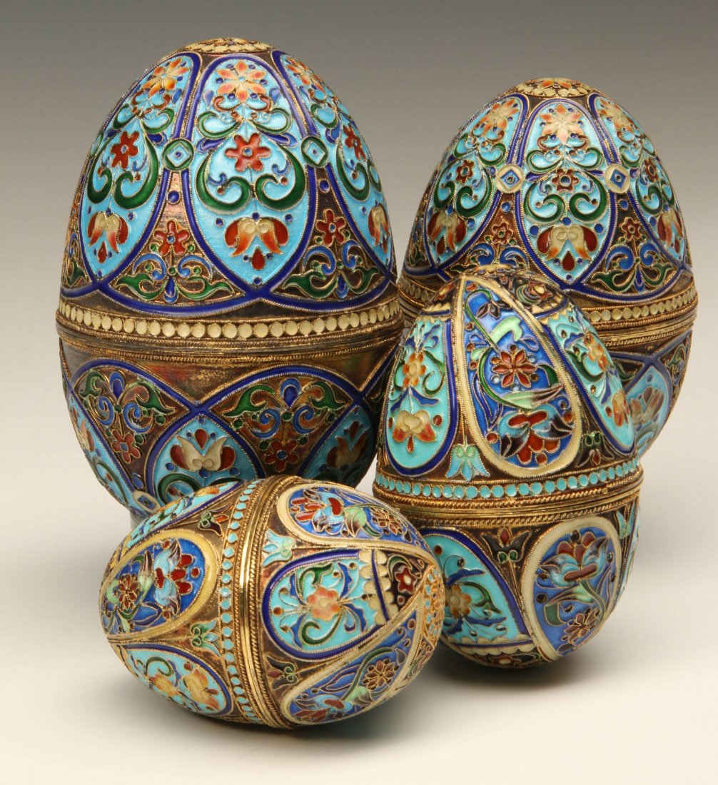 FOUR 20TH CENTURY ENAMELED STERLING CHAMPLEVE EGGS: Four silver gilt eggs with champlevé type enamel decoration. Each is marked 925 at the rim. The sizes vary from 2.75 x 2 inches up to 4.5 x 2.75 inches.