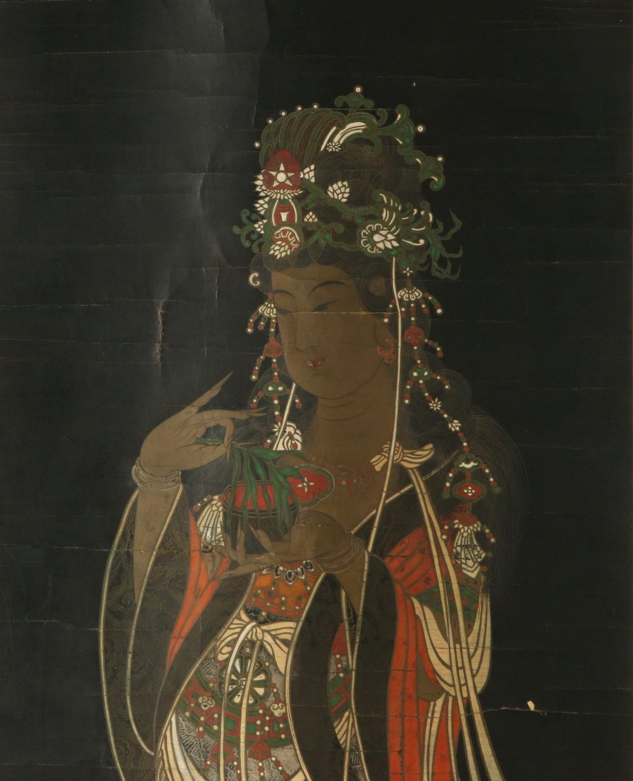 AN EARLY 20TH C. JAPANESE PAINTED BUDDHIST SCROLL: A Japanese hanging scroll of a Kannon Bodhisattva with Willow Branch, ink and colors on indigo-dyed paper, mounted on a brocade scroll mounting, early 20th century. Measures 90 x 25 inches overall.