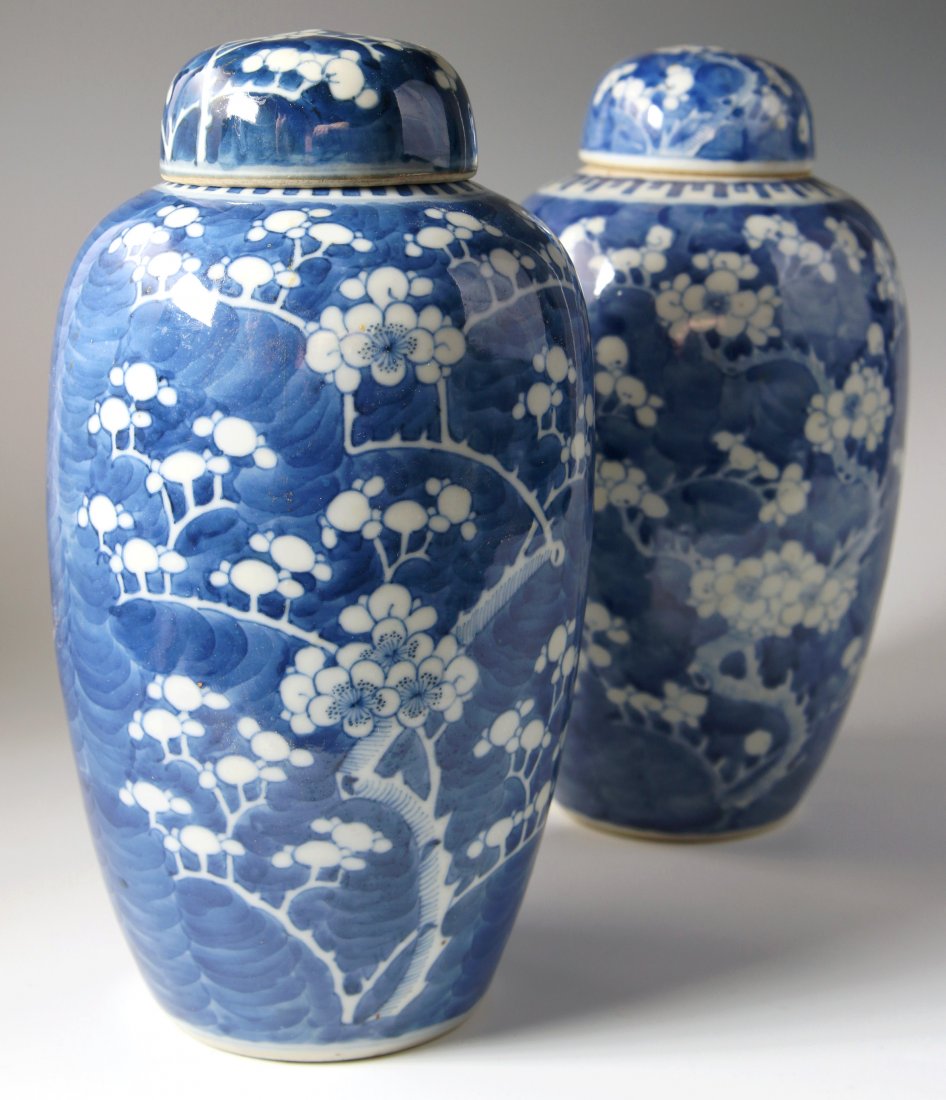 A PAIR OF CHINESE COVERED PORCELAIN GINGER JARS: Each measures 10.5 x 5.5 inches each.