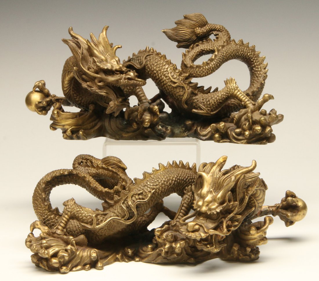 FINELY MODELED GILT BRONZE JAPANESE DRAGON FIGURES: An intricate pair of finely modeled Japanese cast gilt bronze dragon figurines, intricately detailed depictions of dragons in dramatic motion clutching sacred jewels. Circa early 20th century. Each me