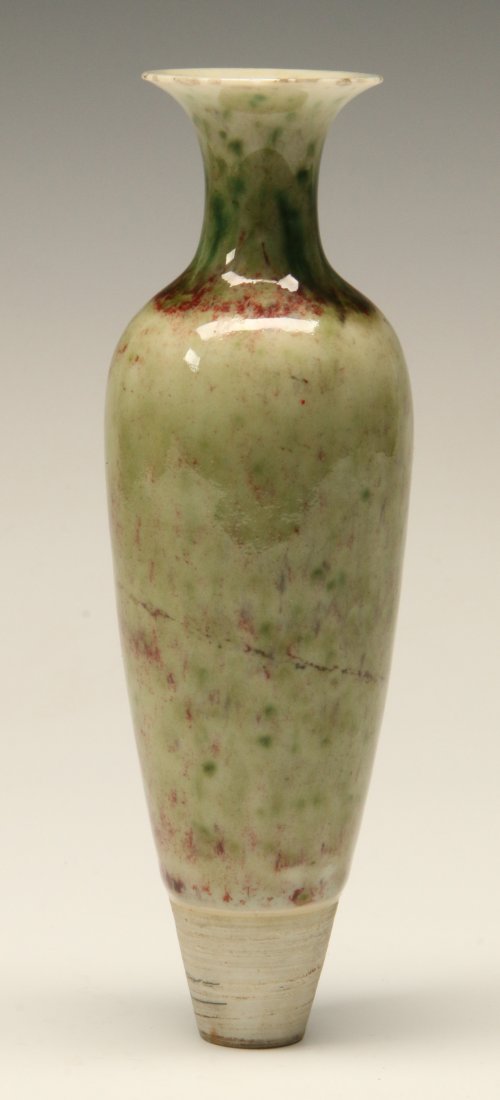 A SMALL ANTIQUE CHINESE AMPHORA FORM VASE: A Chinese amphora-shaped porcelain vase of pale green flambé glaze, fluted lip, unglazed lower section, hollow base. Measures 6.5 x 2 inches.