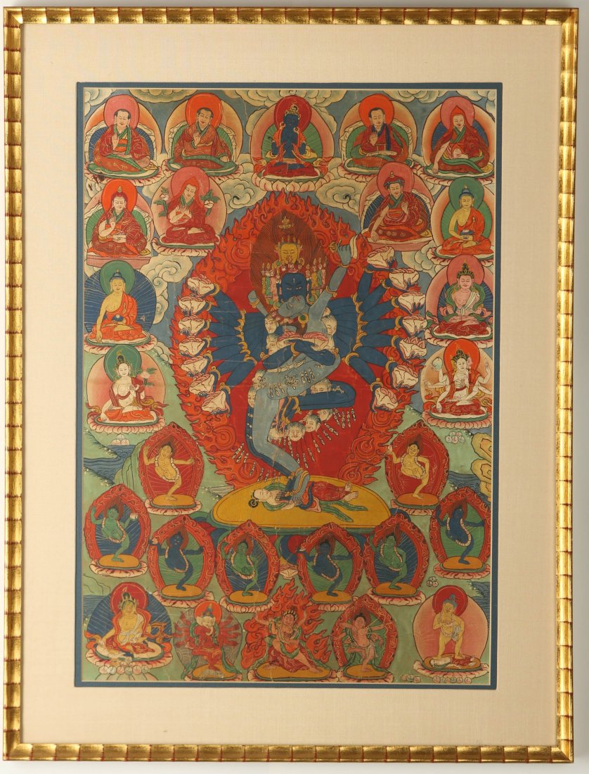 AN EARLY 20TH C. TIBETAN HAND PAINTED BUDDHIST THANGKA: Tibetan thangka, Vajrabhairava Yamantaka with Consort. Sight size measures 21.75 x 15.5 inches. Overall frame 27.5 x 21 inches.