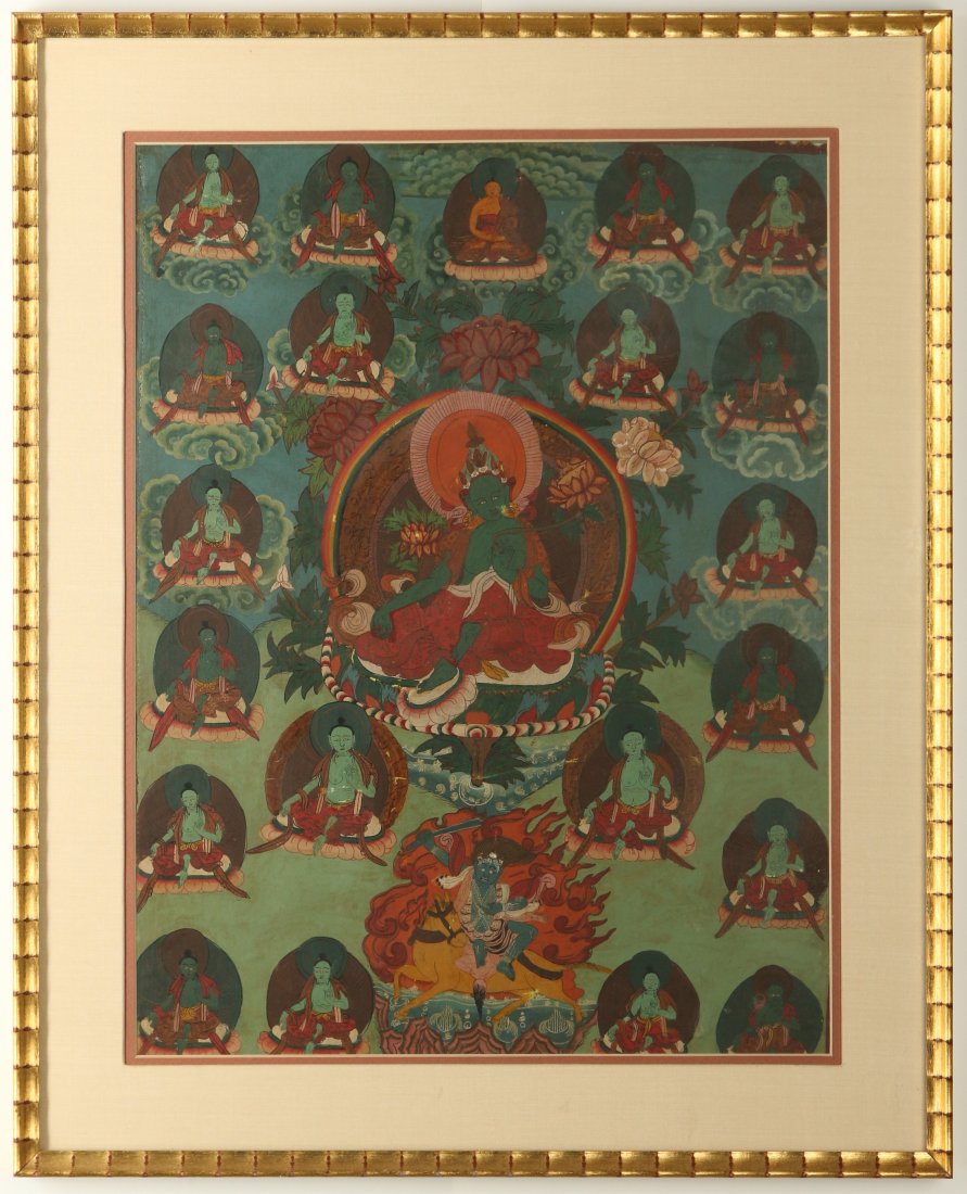 AN EARLY 20TH C. TIBETAN HAND PAINTED BUDDHIST THANGKA: Tibetan thangka, depicting twenty-one Taras with the Green Tara in the center. Sight size measures 21 x 15.5 inches. Overall frame 26.5 x 21.25 inches.