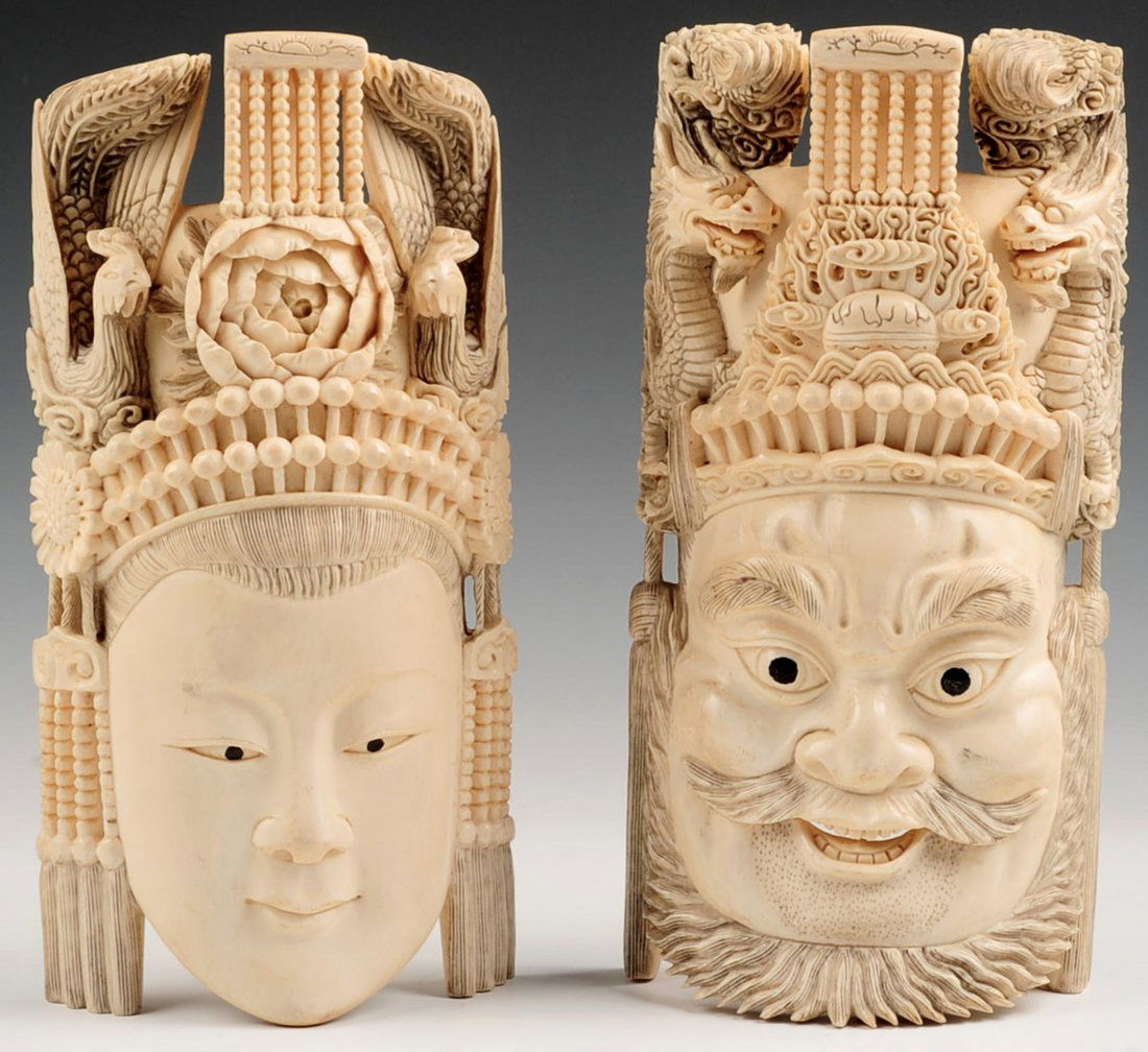 PAIR CHINESE ANTIQUE CARVED IVORY EMPORER EMPRESS MASKS: An intricately carved pair with painted eyes, each measures 8 x 4 inches. This lot will be accompanied by a signed affidavit from the client that this object was in the United States prior to January