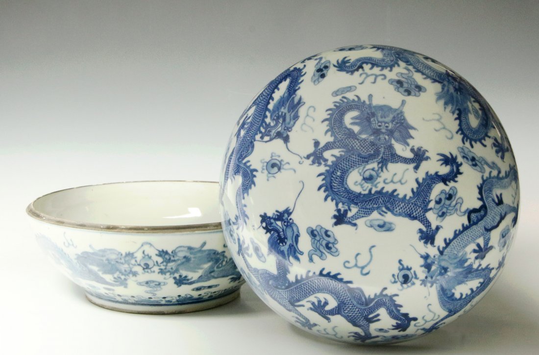 ANTIQUE CHINESE BLUE & WHITE GUANXU PORCELAIN DISH: A Chinese circular dish with domed lid, designs of five-clawed dragons and flaming jewels in underglaze blue, Guangxu reign (1874-1908) mark to base. Measures 7 x 10 inches.