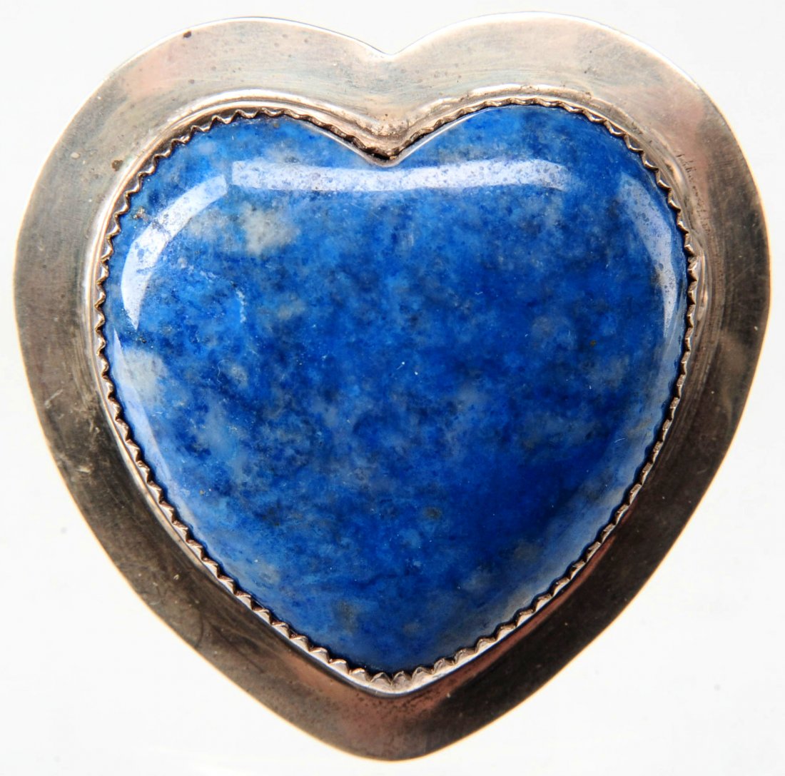 HEART PENDANT/BROOCH IN SODALITE AND STERLING: Heart-shaped sodalite cabochon in a sterling bezel, signed on the back, with a pendant bail and a brooch pin, measures 1.75 x 1.75 inches.