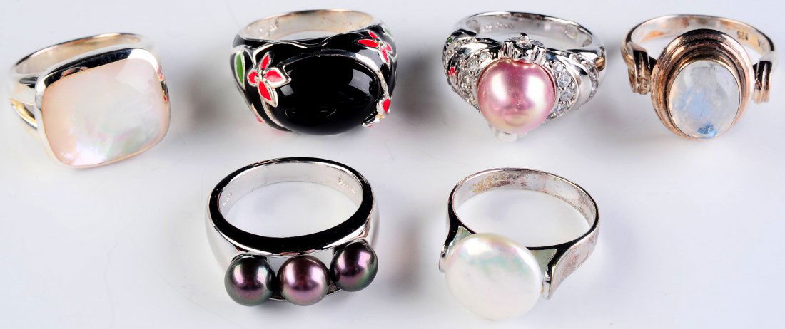 SIX STERLING RINGS WITH PEARL, MOONSTONE OR ENAMEL: Six rings as shown all marked for sterling, ring sizes 8 to 10.