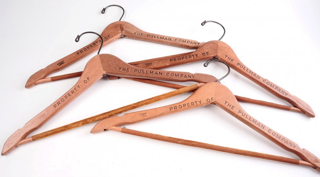 FOUR PULLMAN COMPANY WOODEN HANGERS: Standard size, all marked 'Property of the Pullman Company.'