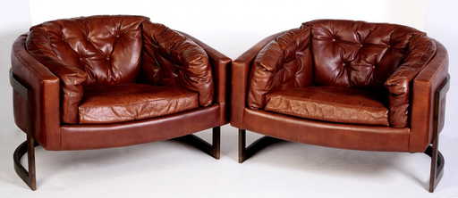 pair metropolitan floating leather barrel chairs