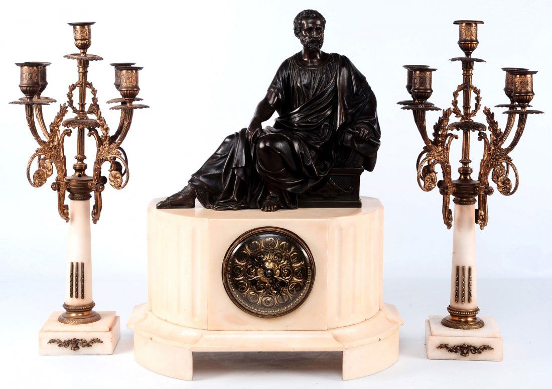 FRENCH MARBLE AND BRONZE CLOCK SET SIGNED H. LUPPENS: A 19th century three-piece clock set with bronze ormolu mounted marble candelabra that measure 18.5 x 9.5 inches on either side of a marble clock with a nice quality well modeled and cast unsigned pat