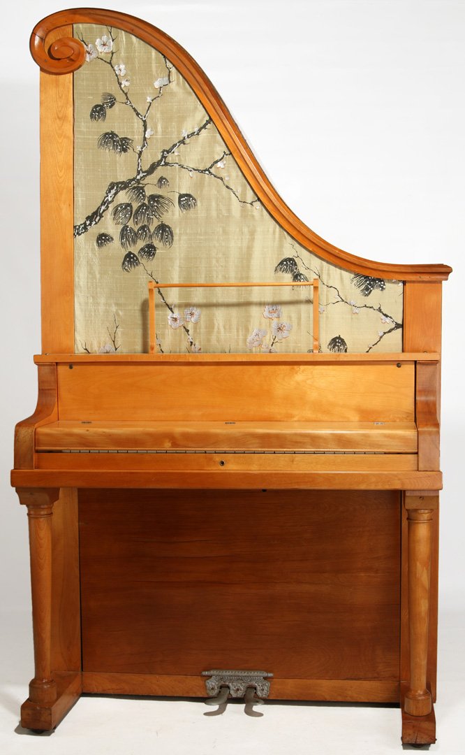A RARE KANSAS INVENTED GIRAFFE PIANO 'THE DOLCETTE': This version of the giraffe piano, or upright piano, was designed and manufactured by Peter Bissing of Topeka, Kansas. According to the Kansas Historical Society, "By simply pressing a key or depressi