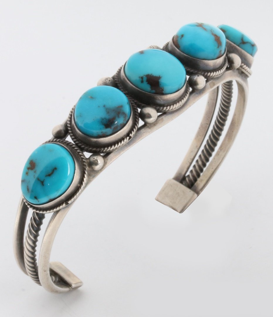 A STERLING SILVER CUFF BRACELET WITH TURQUOISE (1 of 4)