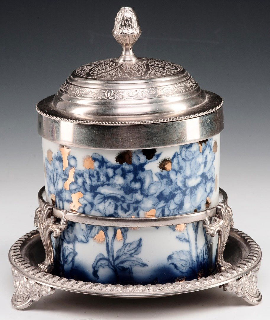 A FLOW BLUE ROYAL DOULTON BISCUIT JAR IN STAND (1 of 10)