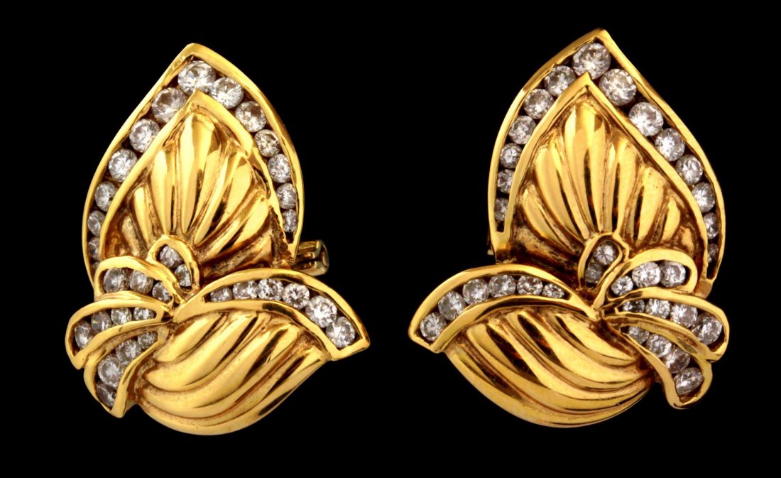 A PAIR OF 18K GOLD CHANNEL SET DIAMOND EARRINGS (1 of 4)