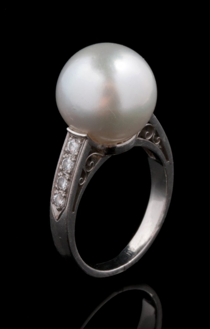 A PEARL AND DIAMOND RING IN A PLATINUM SETTING (1 of 7)