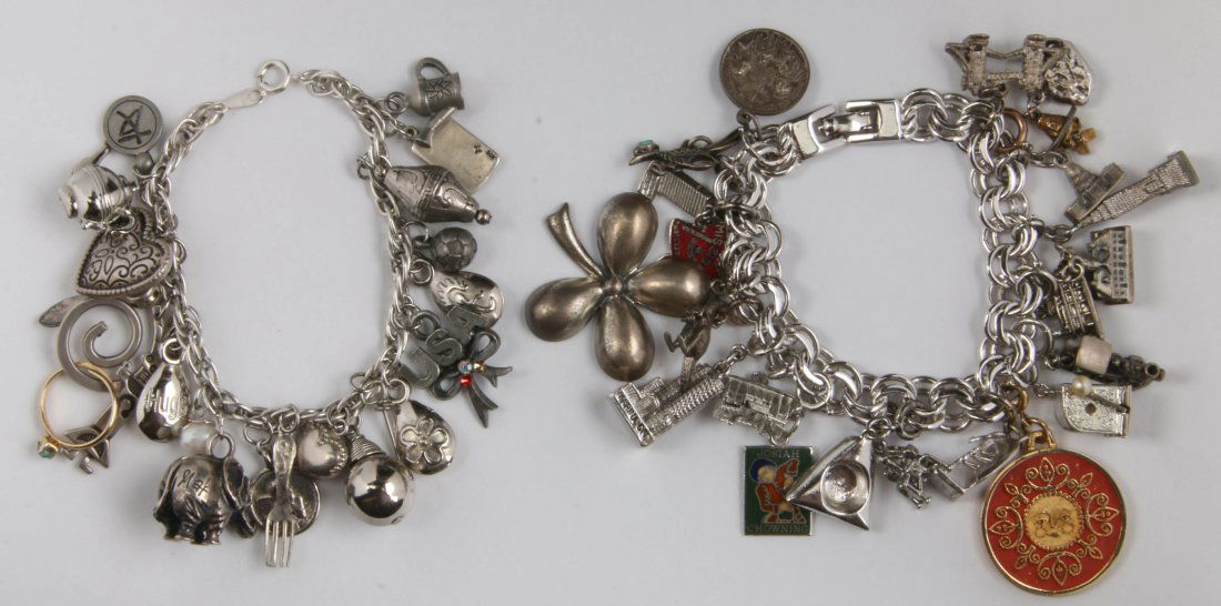 CHARM BRACELETS WITH SOME STERLING CHARMS: The double link is marked Monet on the clasp, has some sterling charms, 7.75 inches long. The unmarked rope style bracelet is 7.5 inches long, twenty-two charms - some sterling.