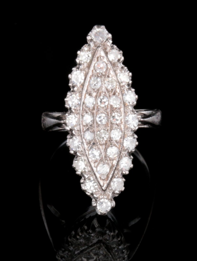 A VINTAGE DIAMOND COCKTAIL RING: Thirty-one .01 carat diamonds in an unmarked hard white metal mounting, ring size 3.25, weighs 6 grams. Provenance: The Joseph Candioto Trust. We ship in-house for all items with the exception of very