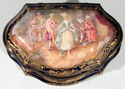 A LARGE AND IMPRESSIVE 19TH C. SEVRES CASKET: The cartouche shape dresser box with a high dome cover centered by a hand painted scene of 18th century courtly couples in an interior setting signed Collinet; and bordered within a pronounced gold de