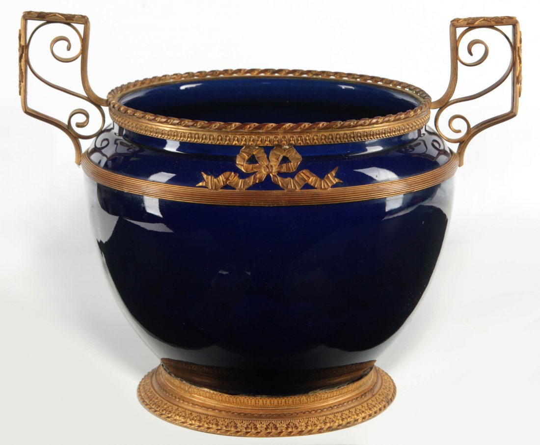 AN EARLY 20TH C. FRENCH JARDINIERE WITH ORMOLU MOUNTS: Measures 11.25 x 14.5 inches including handles. Provenance: The Joseph Candioto Trust. We ship in-house for all items with the exception of very large and or very fragile pieces and some international