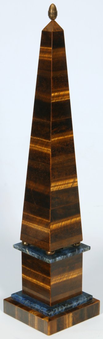 AN EARLY 20TH C. TIGER EYE MINERAL OBELISK WITH LAPIS: Of typical form, the table and the base of the plinth finished with lapis lazuli. The height is 16.75 inches. Provenance: The Joseph Candioto Trust. We ship in-house for all items with the exception o