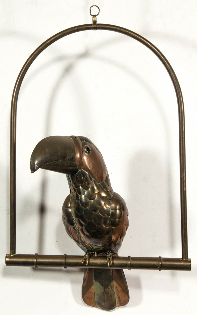 A MIXED METALS TOUCAN FIGURE ATTRIB SERGIO BUSTAMANTE: A mixed metals sculpture of a toucan bird on perch in the direct manner of the Mexican artist and sculptor Sergio Bustamante who made famous this and many other unique designs. measures 8 x 12, perch 