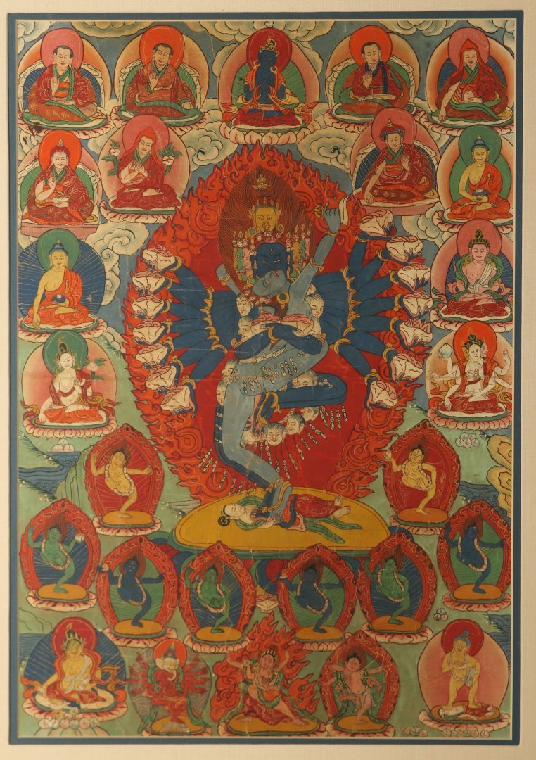 AN EARLY 20TH C. TIBETAN HAND PAINTED BUDDHIST THANGKA: Tibetan thangka, Vajrabhairava Yamantaka with Consort. Sight size measures 21.75 x 15.5 inches. Overall frame 27.5 x 21 inches. We ship in-house for all items with the exception of very large and or v
