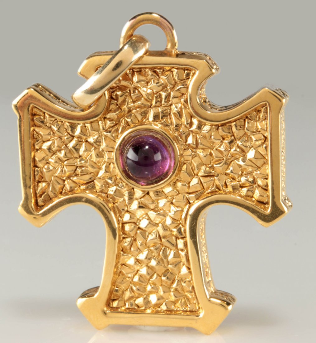 A 14K GOLD CROSS PENDANT: A gold cross pendant with purple cabochon measuring 5 mm, stamped mark of 14k, measures 1.625 x 1.25 including the bail, weight 4.36 grams. We ship in-house for all items with the exception of very la