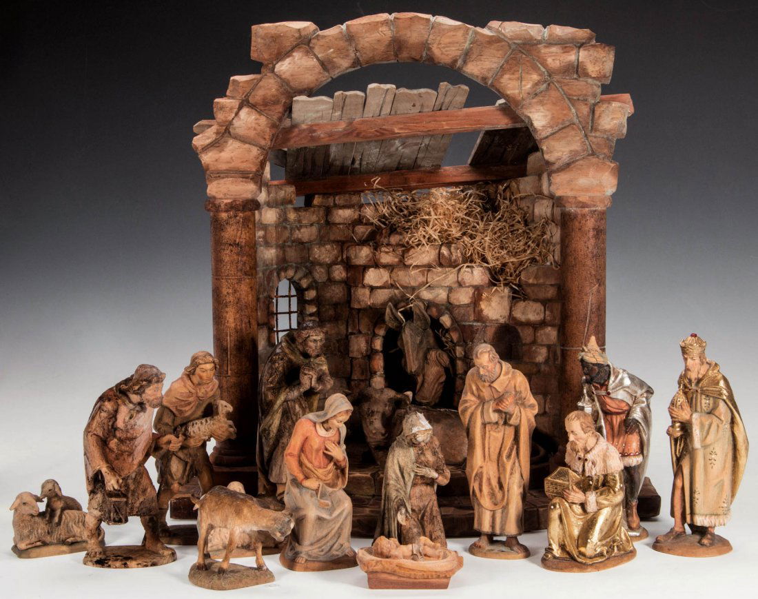 AN ANRI 6-INCH CARVED WOOD NATIVITY SET: Stable with fourteen figures, figures measure from 2.75 to 6 inches, stable measures 15.5 x 14.75 x 10 inches. We ship in-house for all items with the exception of very large and or very fragile piece