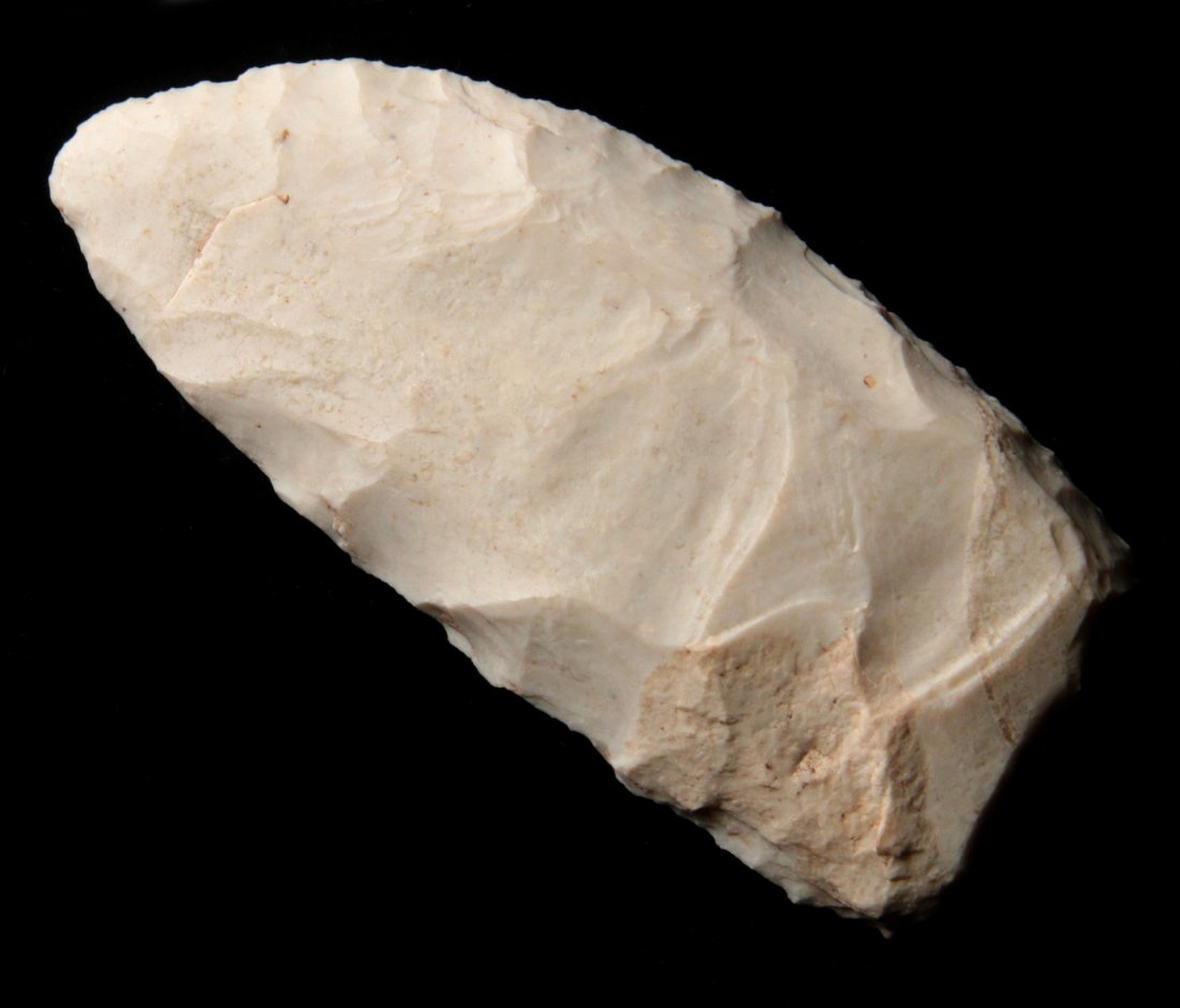 A 3.75 INCH ARCHAIC SCRAPER: Archaic culture. Measures 3.75 x 1.75 inches. George Nichols collection. Marked "W. of Rocheport on hill. No site."