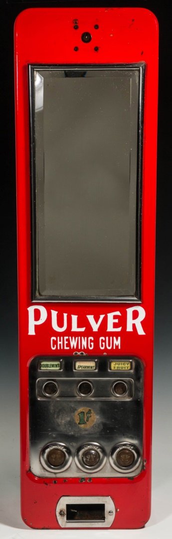 A PULVER THREE COLUMN RED ENAMEL GUM MACHINE: With beveled mirror and three column mechanism. Measures 31 x 8 x 6 inches. We ship in-house for all items with the exception of very large and or very fragile pieces and some international shipments.